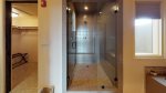 Walk-in tiled shower with glass door